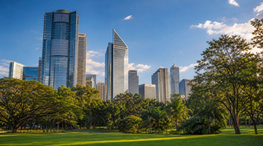 High-rise towers of the Makati central business district seen across a green park